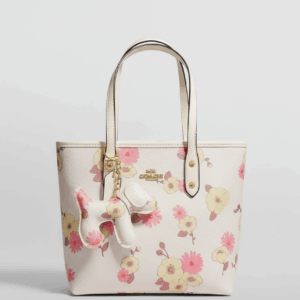 Bolso coach estampado floral con dogcharm